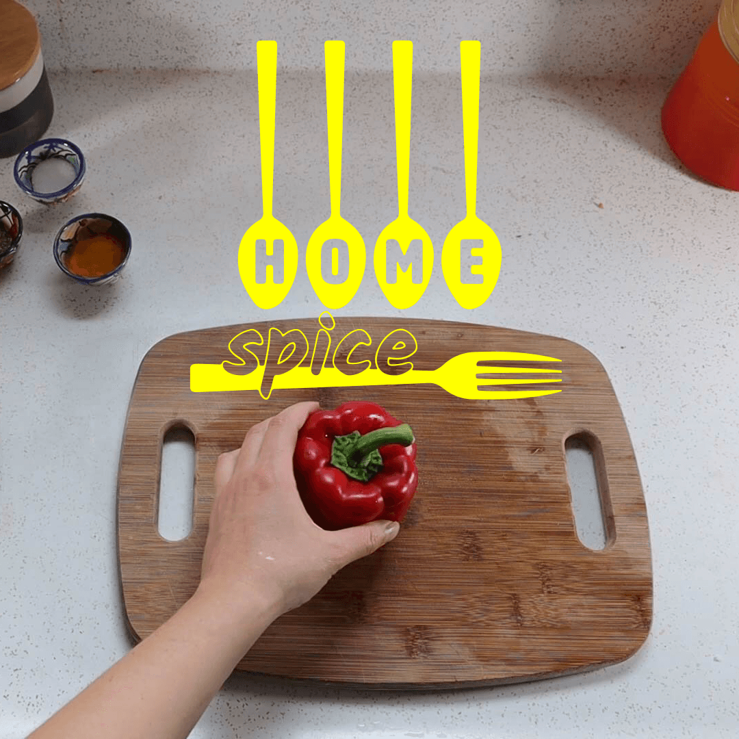 Home Spice cover Art: A cook's hands chopping a red pepper.