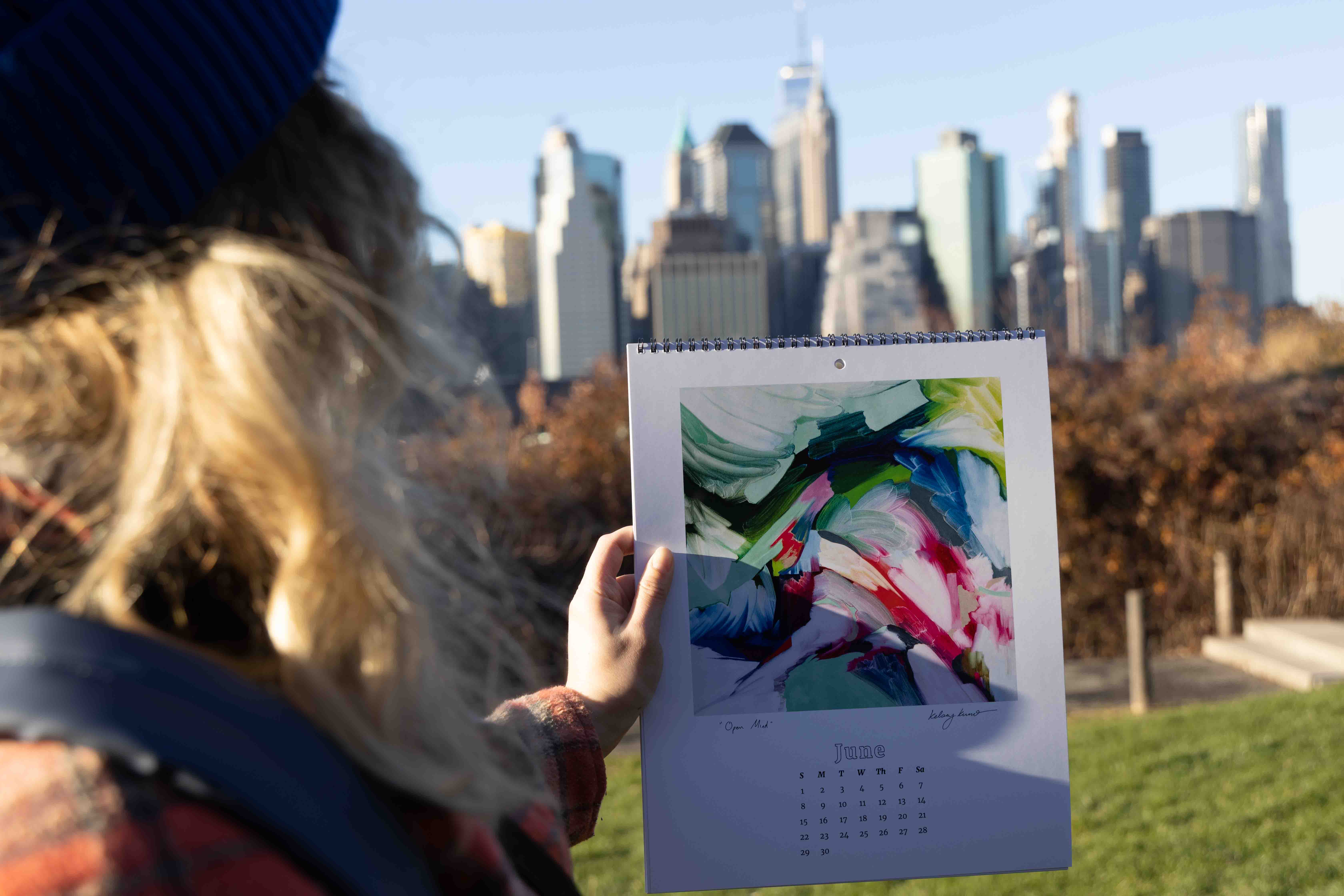 Kelsey Kuno and her promotional calendar in the NY subway